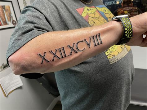 tattoos of roman numerals|cool roman numeral tattoos.